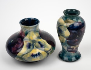 MOORCROFT "Pansy" miniature pottery vase on celadon/blue ground, together with a squat example of the same pattern, (2 items), impressed "MOORCROFT, BURSLEM", 9.5cm and 7.5cm high.
