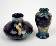 MOORCROFT "Pansy" miniature pottery vase on celadon/blue ground, together with a squat example of the same pattern, (2 items), impressed "MOORCROFT, BURSLEM", 9.5cm and 7.5cm high. - 2