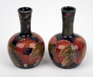 MOORCROFT "Pomegranate" pair of miniature pottery vases on celadon/blue ground, impressed "MOORCROFT, BURSLEM", 9.5cm high.