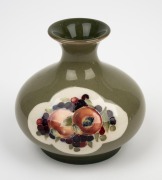 MOORCROFT "Pomegranate and Berries" pottery vase on early celadon ground, impressed "Moorcroft, England, Burslem" with green signature mark, ​​​​​​​8.5cm high. - 2
