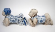 A pair of reproduction Chinese blue and white figural porcelain headrests, 20th century, 22cm high, 32cm long. - 4