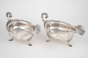 A pair of antique English sterling silver sauce boats, made in Sheffield, circa 1905, ​​​​​​​11cm high, 22cm wide, 690 grams total.