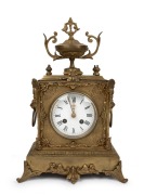 An antique French mantle clock in ornate gilt metal case, with eight day time and bell striking movement and Roman numerals, 19th century, ​​​​​​​36cm high.