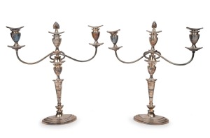 142 · A pair of English silver plated three branch candelabra, 20th century, ​​​​​​​48cm high, 43cm wide.