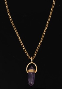 355 · A 9ct gold and amethyst pendant, suspended on a 9ct gold chain, 20th century, the pendant 3.3cm high, the chain 43cm long and 4.5 grams.