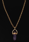 A 9ct gold and amethyst pendant, suspended on a 9ct gold chain, 20th century, the pendant 3.3cm high, the chain 43cm long and 4.5 grams.