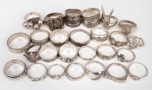 Twenty five assorted rings, mostly silver, 115 grams total.