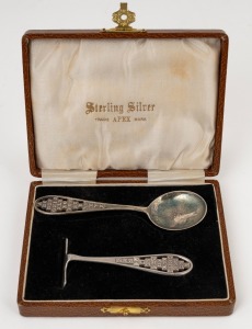 Apex sterling silver (retailed by Rodd) infant's spoon and food pusher, both featuring the letters of the alphabet; circa 1930, presented in the original silk and plush-lined presentation box. (2 items), 40 grams.