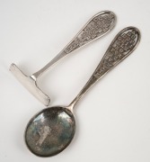 Apex sterling silver (retailed by Rodd) infant's spoon and food pusher, both featuring the letters of the alphabet; circa 1930, presented in the original silk and plush-lined presentation box. (2 items), 40 grams. - 2