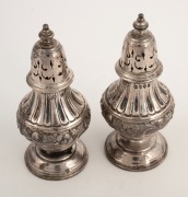 A pair of sterling silver pepper pots, made in London, circa 1885stamped "JSB", in original plush lined presentation box for Skinner of Orchard Street, London, 9cm high, 87 grams. - 2
