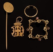 An 18ct two tone gold wedding band (1.8 grams), an antique 15ct gold brooch with stones (missing pin, 3.8 grams), an antique 9ct gold fob (1.2 grams); together with a 22ct gold William III one guinea coin mounted as a stickpin (3.3 grams), (4 items), 10.3
