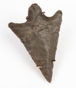 A Neolithic pressure flaked stone arrowhead, mounted as a brooch in 9ct rose gold, 4cm long.