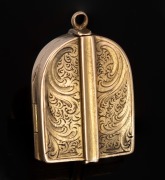 An antique 15ct photo triptych pendant with 9ct gold interior, 19th century, (15ct gold 5.4 grams), (9ct gold 2 grams), 8.3 grams including silk and glass.