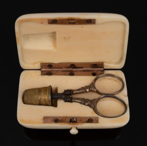 An antique ivory pocket sewing etui with rose gold mounts, early 19th century, 7.5cm wide.