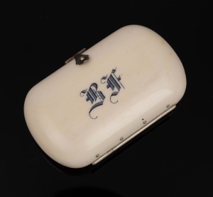 An antique ivory coin purse with blue silk interior, 19th century, 7.5cm wide.