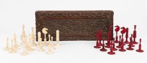 An antique turned bone chess set, housed in an attractive antique Indian carved sandalwood glove box, 19th century, ​​​​​​​the kins 7cm high, 2.5cm diameter base, the box 28cm wide.