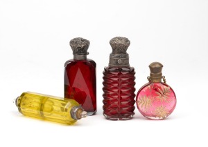Four antique coloured glass scent bottles with silver and gilt metal fittings, (A/F), 19th century, ​​​​​​​the largest 9.5cm high.