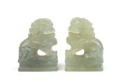 A pair of Chinese carved celadon jade lion statues, 20th century, ​​​​​​​7cm high.