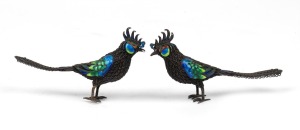A pair of Chinese filigree silver and enamel bird ornaments, 20th century, 7cm high, 11cm long, 86 grams total.