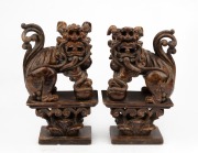 A pair of Chinese carved stone Foo dog seal ornaments, 20th century, ​​​​​​​19cm high.