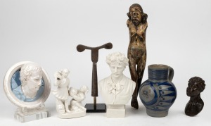 Antique polychrome carved wooden statue (missing arms), Coptic processional cross on later stand, bisque porcelain bust of Paderewski, pottery wall plaque, carved wooden bust of an African head, Chinese blanc de chine figure group and a German stoneware v