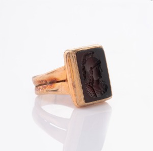 An antique 9ct rose gold and hardstone intaglio cut cameo seal ring, 19th century, 9.2 grams total.