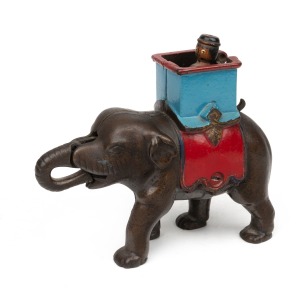An antique cast iron elephant mechanical bank with painted finish, 19th/20th century, 15cm high.
