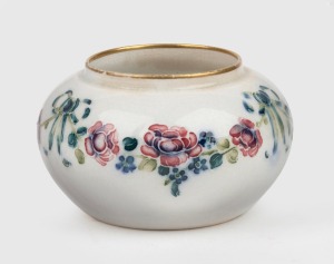 MOORCROFT floral pattern squat vase on cream ground, stamped "MACINTYRE, Burslem, England" with green signature mark, 4.5cm high, 8cm diameter.