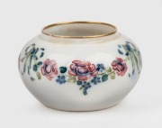 MOORCROFT floral pattern squat vase on cream ground, stamped "MACINTYRE, Burslem, England" with green signature mark, ​​​​​​​4.5cm high, 8cm diameter.