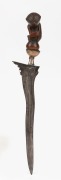 An antique kris dagger with ornately carved wooden handle and gold plated fittings, South East Asian origin, 19th/20th century, 31cm high.