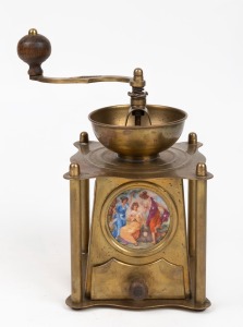 An antique Austro-Hungarian brass coffee grinder with circular porcelain panel, 19th/20th century, 24cm high.