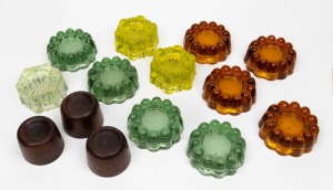 Assorted antique and vintage glass and timber piano rests, including uranium examples, 19th and 20th century, (14 items).