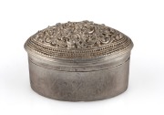 A Burmese silver betel box with floral repousse decoration, 20th century, 5.5cm high, 7.5cm wide, 71 grams total.
