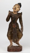 An antique Burmese carved wood and polychrome statue of a lady, inlaid with coloured glass and gilt finish, 19th/20th century, A/F, 51cm high.