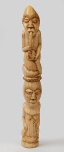 A tribal totem, carved hippopotamus teeth, African origin, early to mid 20th century, 30cm high.