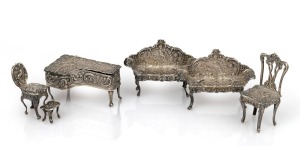76 · Assorted English sterling silver dolls house furniture, 20th century, ​​​​​​​(note: leg missing on one sofa), the piano 6cm long, 77 grams total.