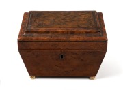 An antique English burr elm sarcophagus shaped tea caddy with brass bun feet, early 19th century, attractive small size 13cm high, 16cm wide, 11cm deep.