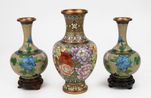 249 · A vintage Chinese cloisonne vase together with a pair of Chinese cloisonne vases on carved wooden stands, 20th century, (3 items), ​​​​​​​the largest 26.5cm high.