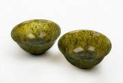 Two Chinese spinach jade bowls, 20th century, 6cm high, 13cm diameter.