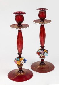 BAROVIER & TOSO pair of Murano ruby glass candlesticks with gold inclusions, applied floral decoration and white trim, mid 20th century, ​​​​​​​29cm high.