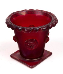 A Murano ruby glass vase with opalescent finish, decorated with applied lion masks and raspberry prunts, early 20th century, 10cm high.