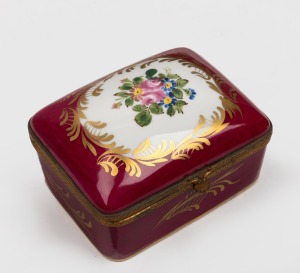 A French burgundy porcelain jewellery casket with hand-painted floral decoration and gilt metal mounts, 20th century, 11cm wide.