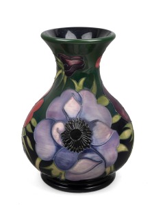 MOORCROFT "Anemone" English pottery vase on green ground, with impressed factory mark to base, dated 2003, 16cm high.