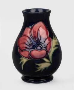 MOORCROFT "Anemone" English pottery vase on blue ground, with impressed factory mark to base, dated 1994, 9.5cm high.