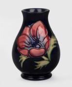 MOORCROFT "Anemone" English pottery vase on blue ground, with impressed factory mark to base, dated 1994, 9.5cm high.