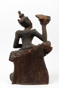 An antique Burmese carved wood and polychrome finished statue of a lady holding a conch shell, 19th/20th century, 49cm high. - 2