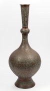 An antique Indo-Persian copper and brass vessel, 19th/20th, note: holed for lamp conversion, ​​​​​​​70cm high.