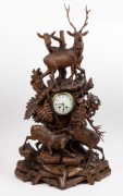 BLACK FOREST antique timber clock case with carved deer and stag decoration, housing a later clock movement, 19th and 20th century, Note: several losses and condition issues, ​​​​​​​102cm high.