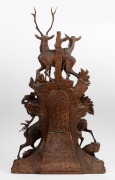 BLACK FOREST antique timber clock case with carved deer and stag decoration, housing a later clock movement, 19th and 20th century, Note: several losses and condition issues, ​​​​​​​102cm high. - 2