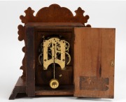 ANSONIA antique American shelf clock in oak case with eight day time and strike movement and Roman numerals, 19th century, ​​​​​​​35.5cm high. - 2